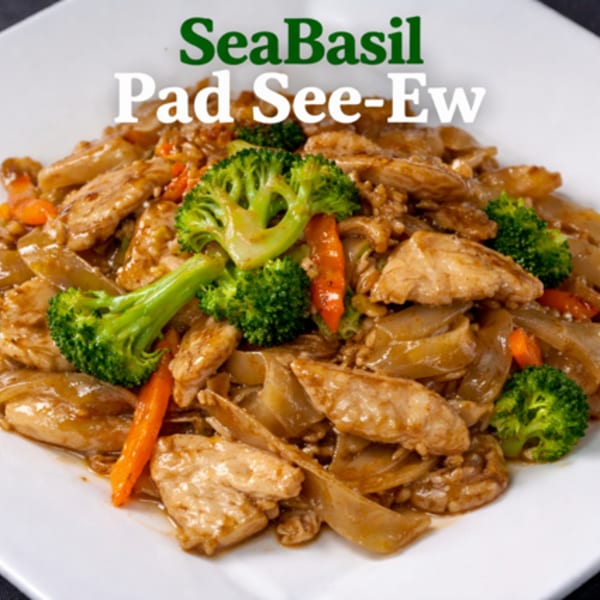 A close-up of Seabasil Thai & Seafood's Pad See-Ew with chicken, broccoli, and carrots.
