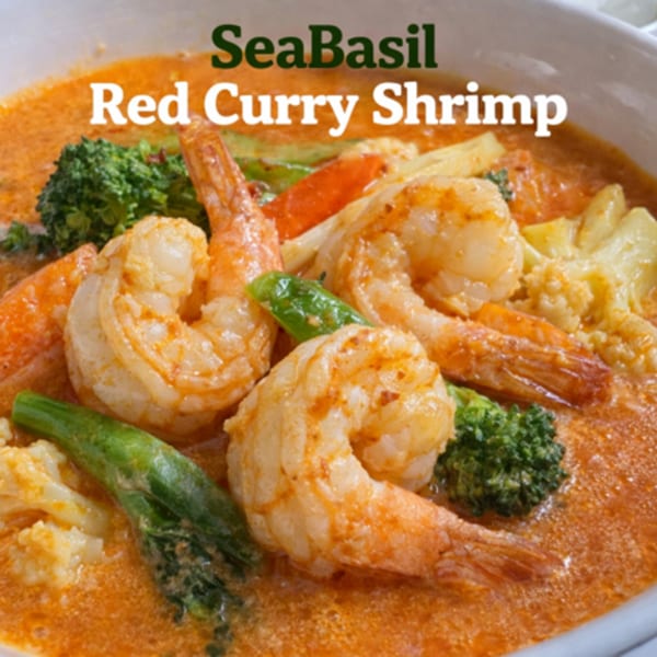 Close-up of Seabasil Thai & Seafood's Red Curry Shrimp with broccoli, cauliflower, and snap peas.